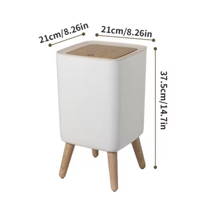 Poubelle salle de bain blanche avec couvercle en bois et pieds en bois.
